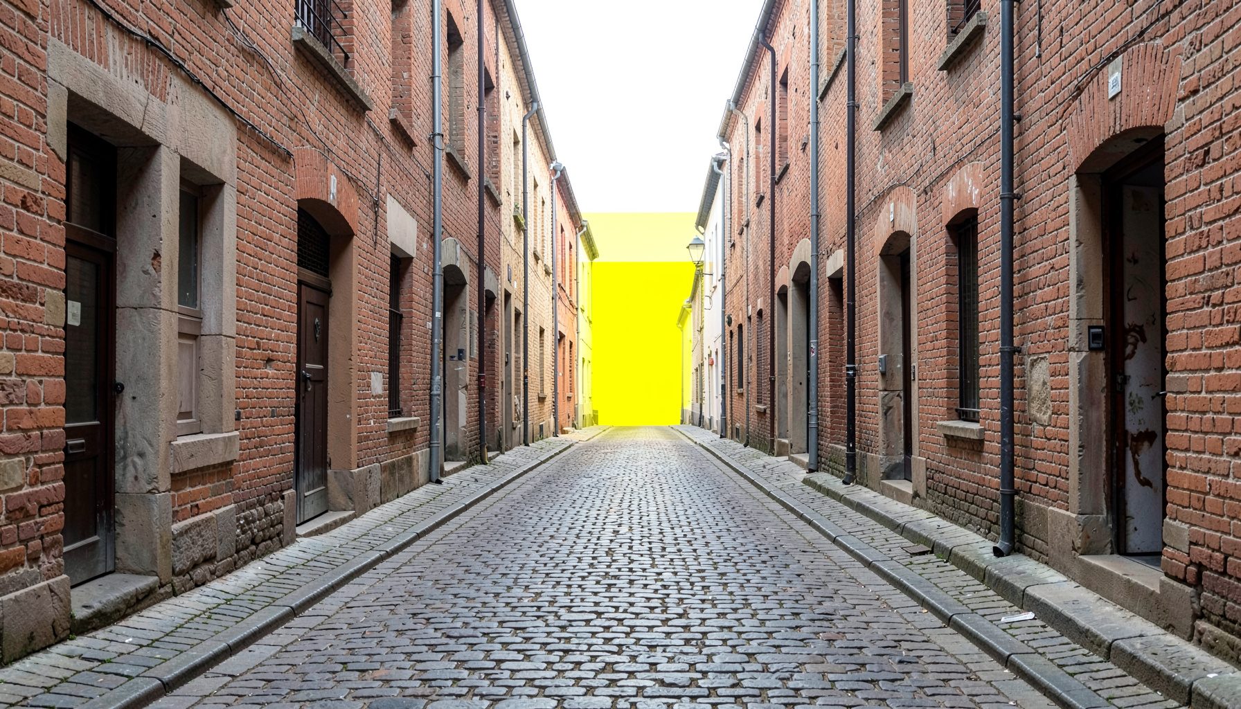 Symmetrical view of a quiet cobblestone alley lined with old brick buildings, soft diffused daylight, muted terracotta and stone tones